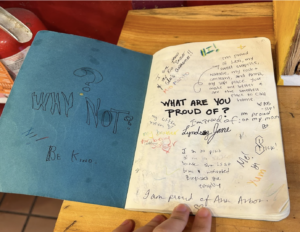 Image of a community journal page with the title "What are you proud of?" at the RoosRoast Liberty Coffee, Ann Arbor